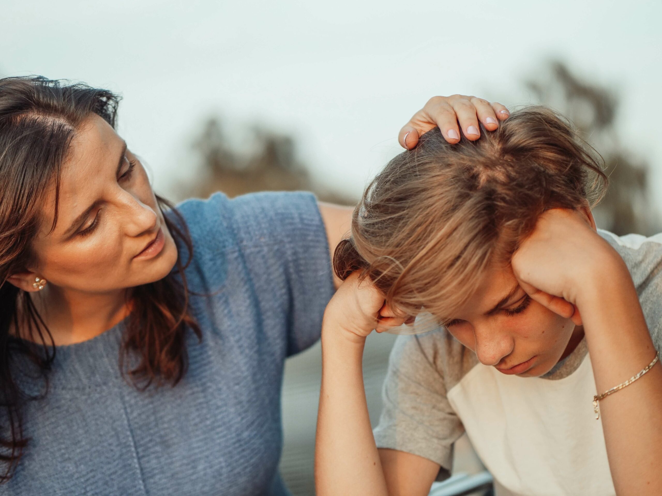 mother comforting boy